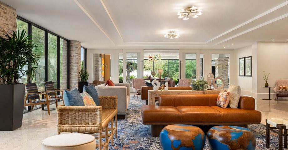 Venue lobby. A bright, open space filled with couches, chairs, tables for guests to relax.